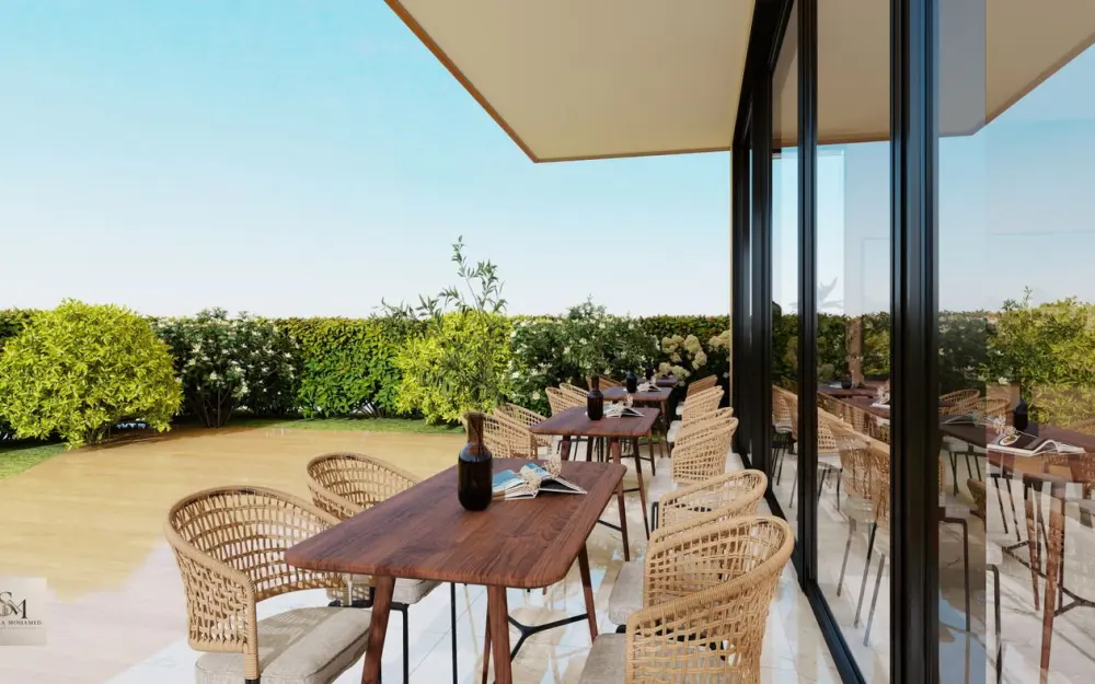 Symbolbild: Elegant outdoor dining with wicker chairs and wooden tables on a sunny patio.