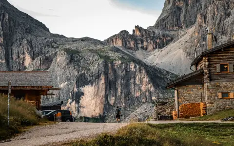 Symbolbild: Explore the breathtaking Dolomites in Trentino, featuring stunning cliffs and rustic huts.